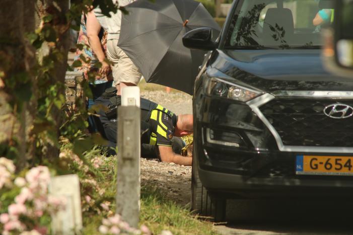 Opzittende scooter gewond na val