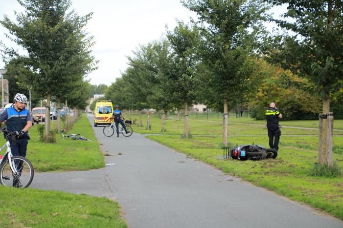 Fietser en scooterrijder gewond na aanrijding