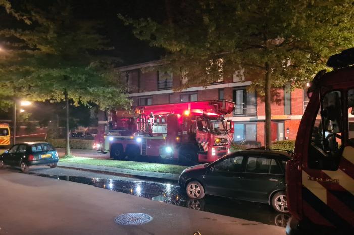 Personen en hond met klachten bij brand