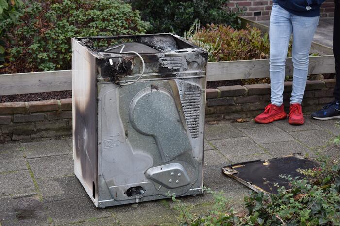 Wasmachine vat vlam
