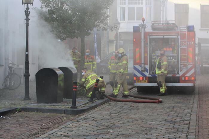 Veel rook door brand in ondergrondse container