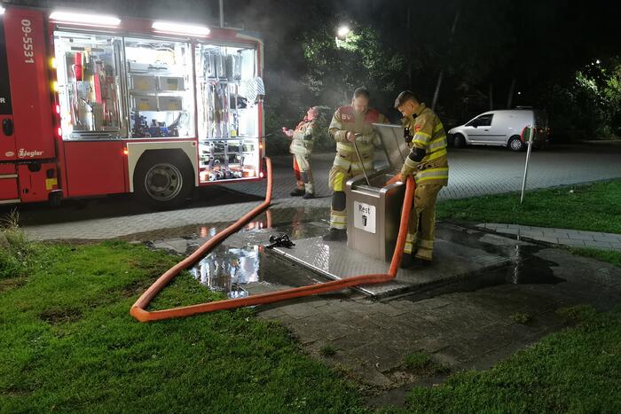 Flinke brand in ondergrondse container