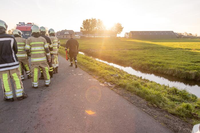 Man met scootmobiel te water