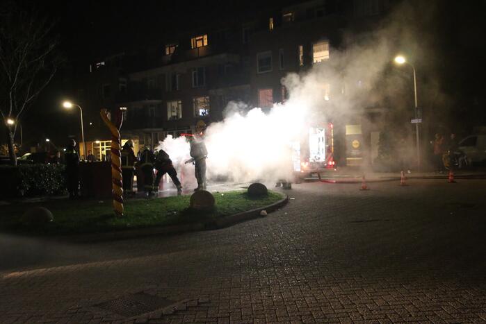 Ondergrondse container in brand