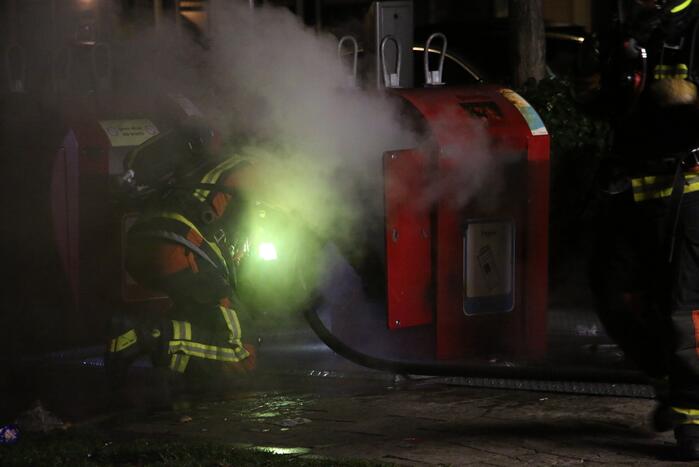 Ondergrondse container in brand