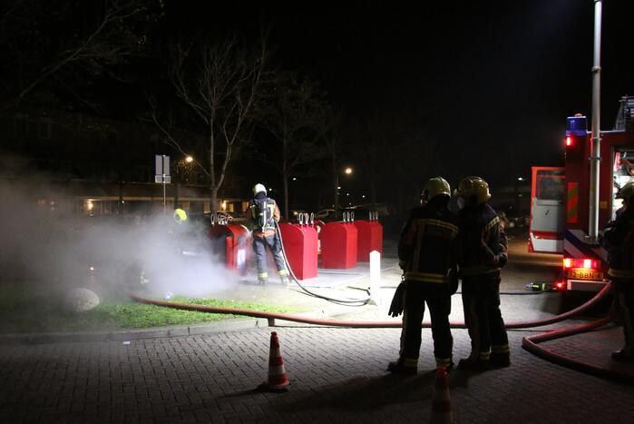 Ondergrondse container in brand