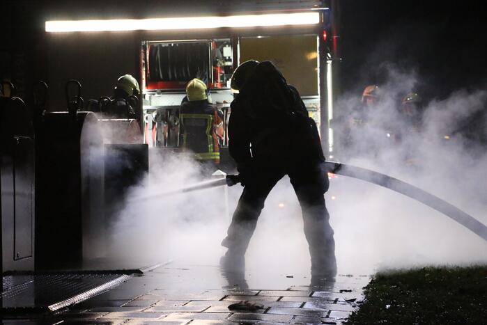 Ondergrondse container in brand