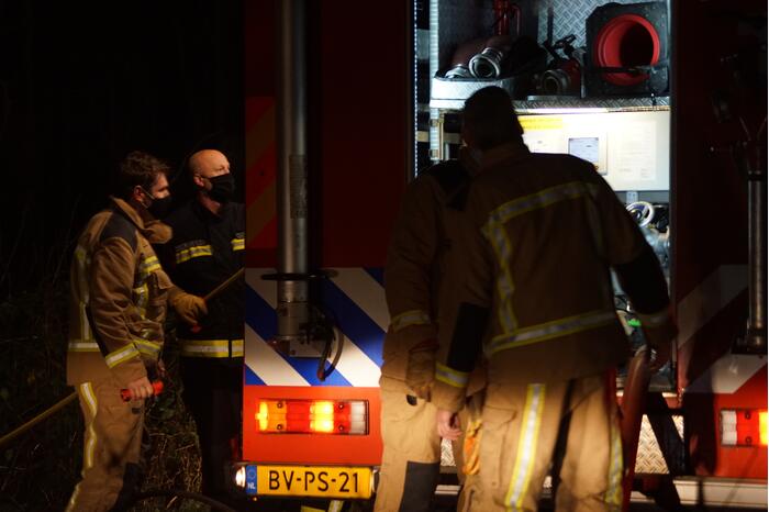Afvalbrand in bosgebied