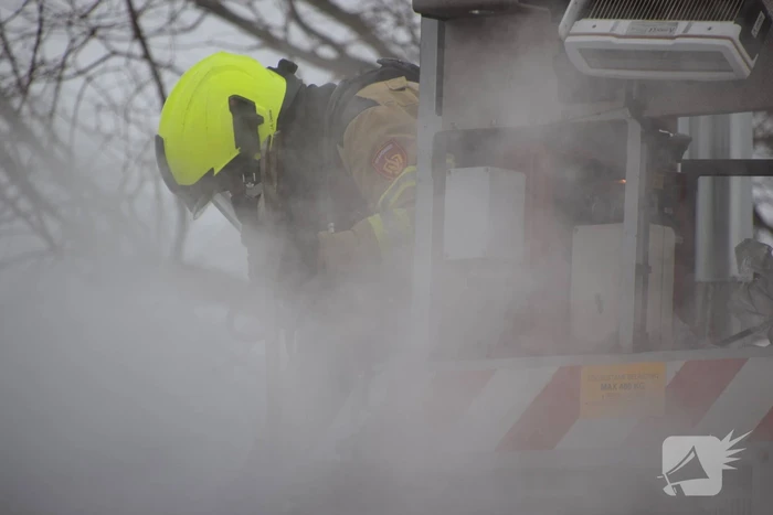 Brand in garage door houtkachel