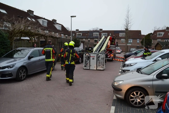 Schoorsteen woning in brand