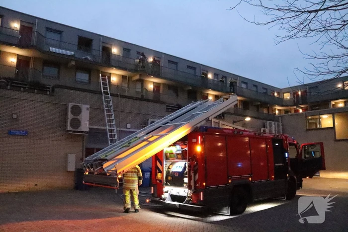 Brand in flatwoning boven winkels
