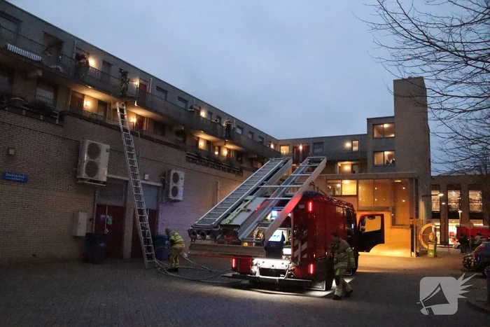 Brand in flatwoning boven winkels