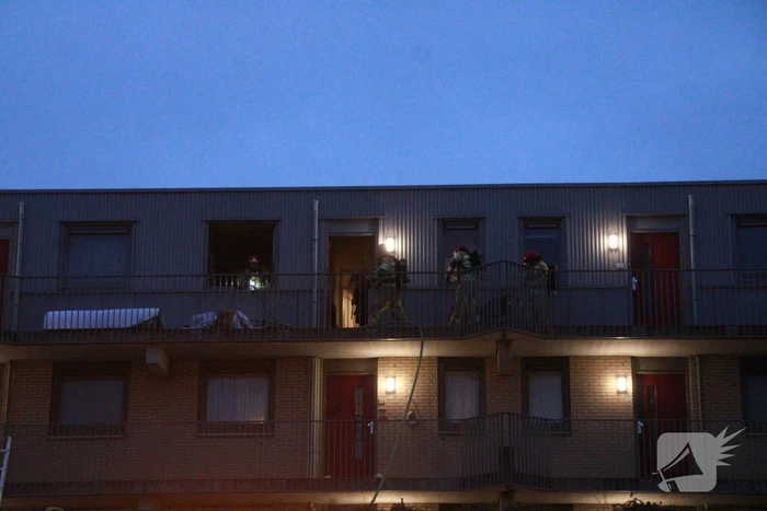Brand in flatwoning boven winkels