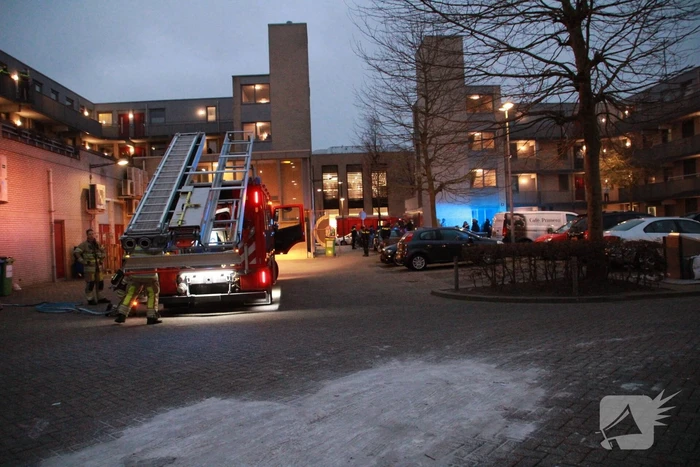 Brand in flatwoning boven winkels