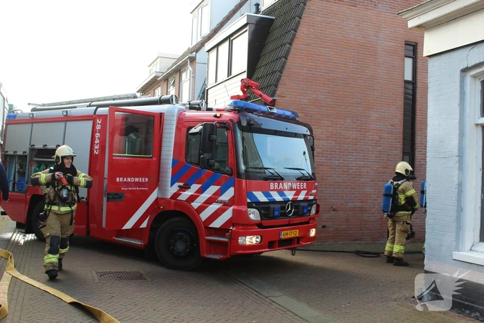 Brand naast schuur in brandgang