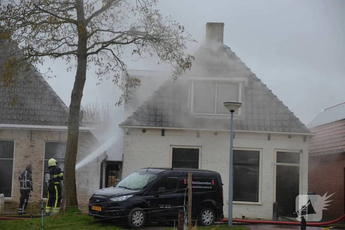 Woning vol rook bij brand