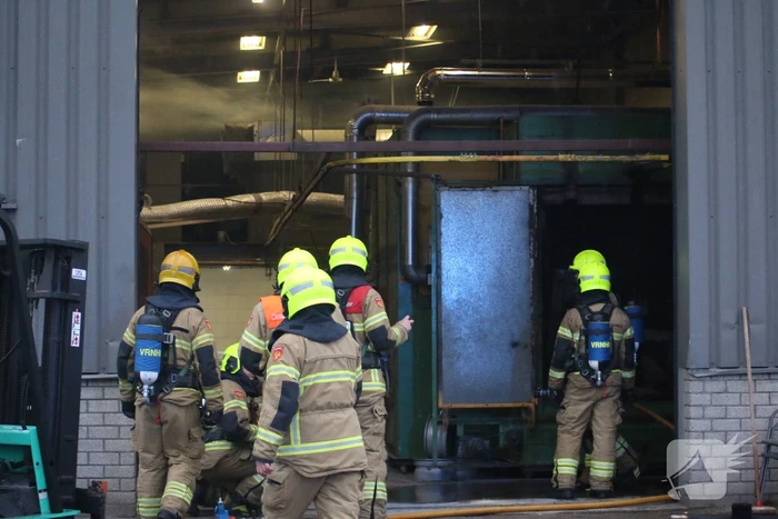 Veel rookontwikkeling na brand in machine