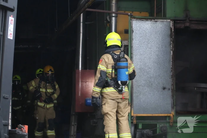 Veel rookontwikkeling na brand in machine