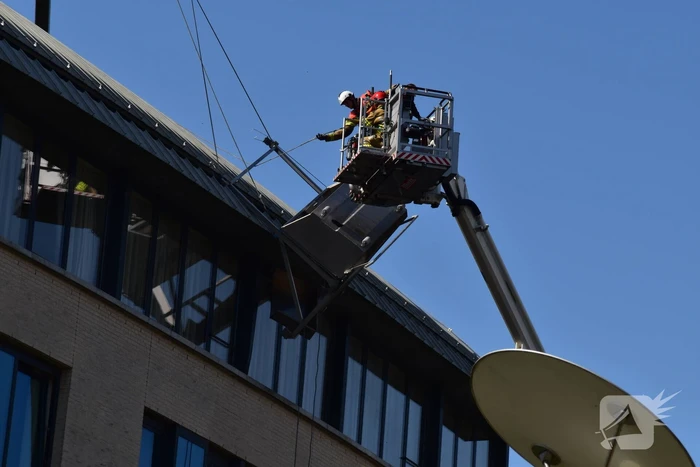 Glazenwasser vast in op hol geslagen lift