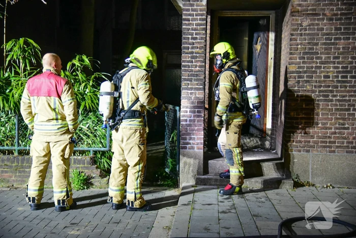 Brand in portiek van woning