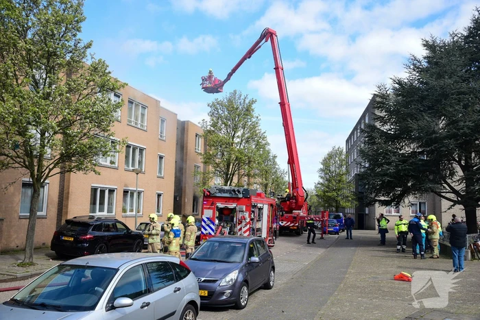 Meerdere bewoners door brand opgesloten in woningen