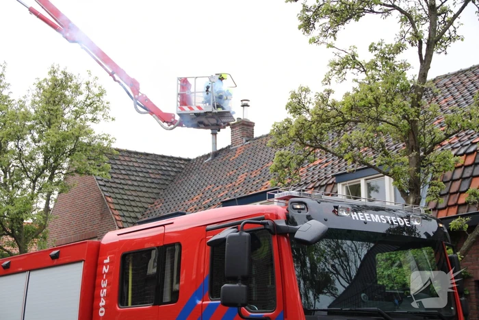 Veel rook bij brand in schoorsteen