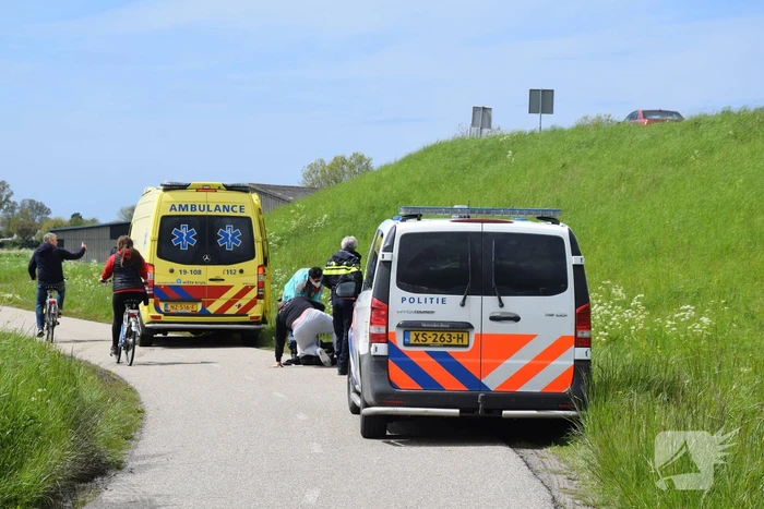 Persoon ten val met scooter