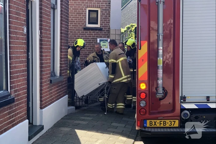 Witgoed-apparaat vat vlam in woning