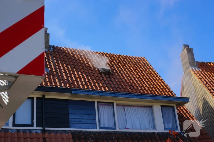 Grijze rookontwikkeling brand in woning