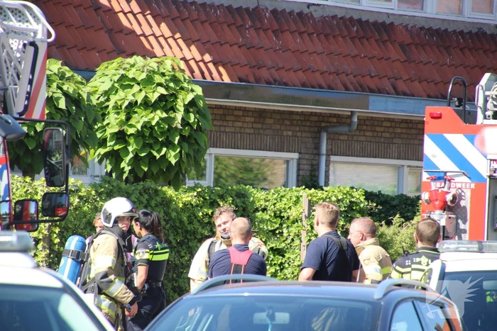 Grijze rookontwikkeling brand in woning