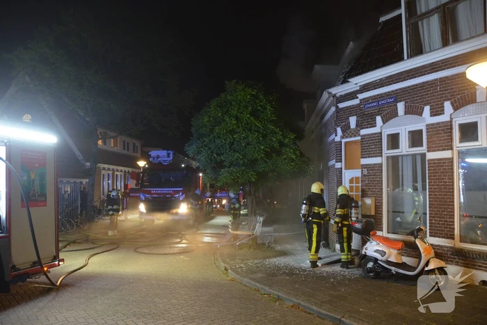 Uitslaande brand in woning
