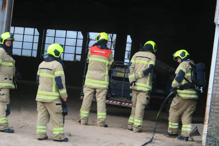 Zaagsel in brand in leegstaande loods