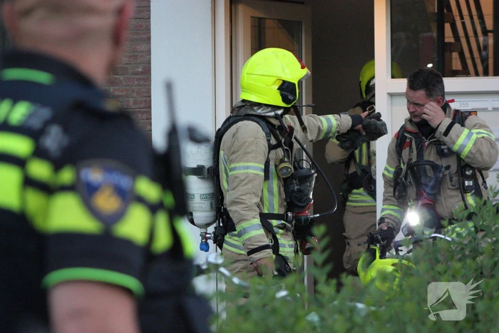 Flat deels ontruimd door brandlucht