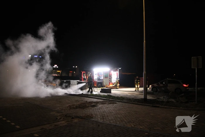 Vlammen bij brand in container