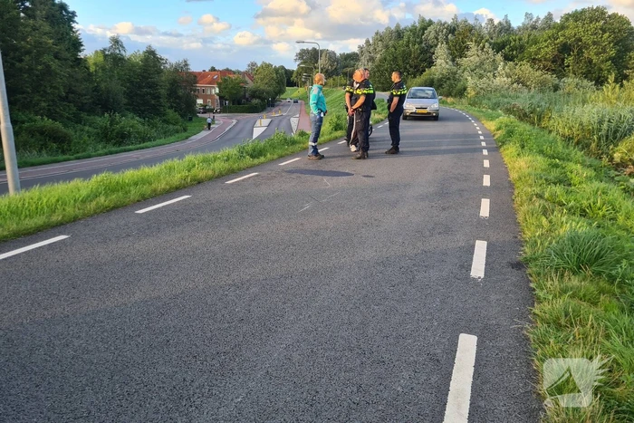 Persoon ten val met scooter