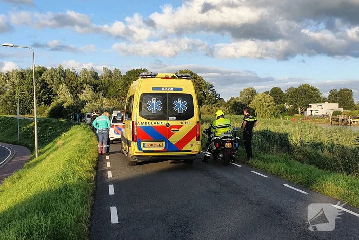 Persoon ten val met scooter
