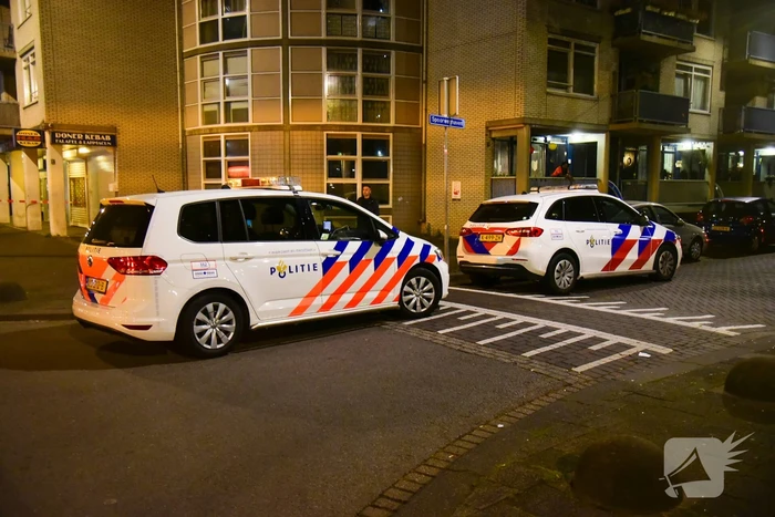 Schoten gelost op woning en winkelpand
