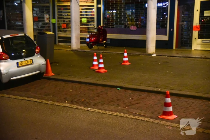 Schoten gelost op woning en winkelpand