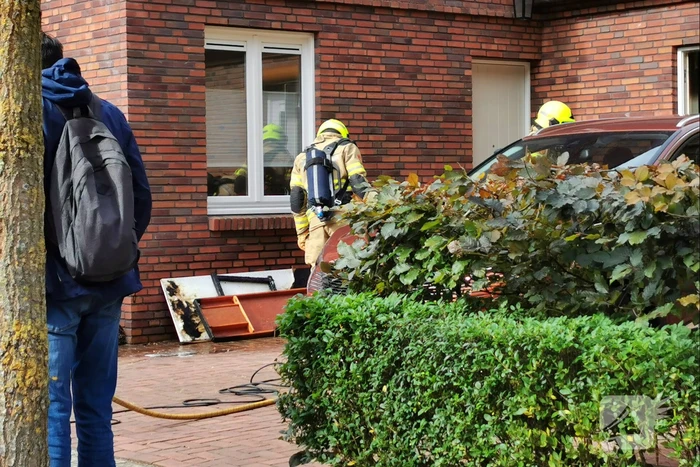 Brand in schuur naast woning