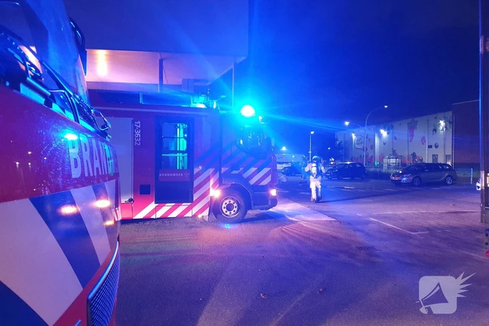 Rookontwikkeling door brand in perscontainer