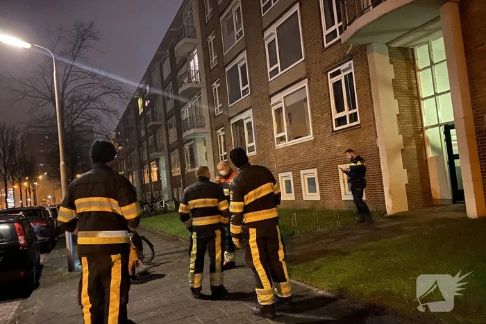 Deur ingeslagen vanwege brand
