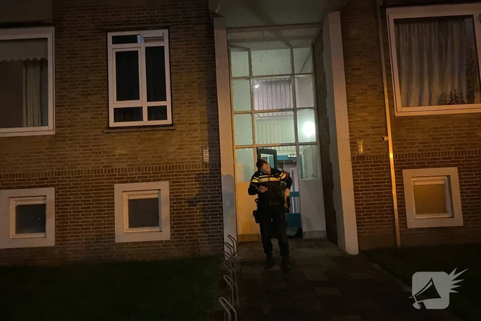 Deur ingeslagen vanwege brand
