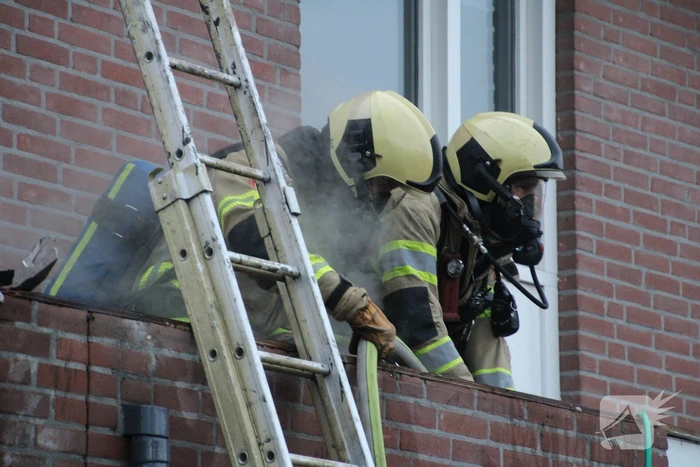 Brand in afzuigkap van woning