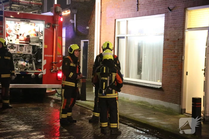 Rookontwikkeling door brand in schoorsteen van woning
