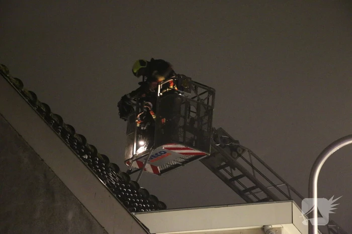 Rookontwikkeling door brand in schoorsteen van woning