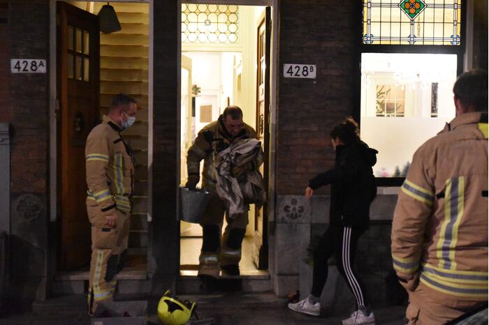 Opgehoopt roet in schoorsteen zorgt voor brand