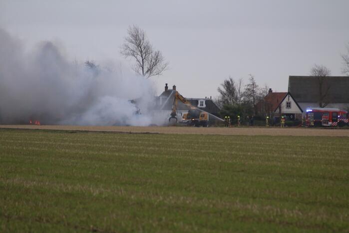 Brand in schuur met gestalde caravans