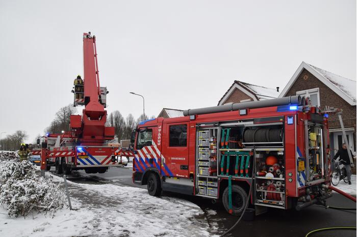 Brand in garage door houtkachel