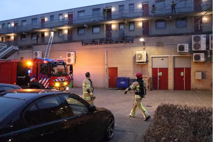 Brand in flatwoning boven winkels