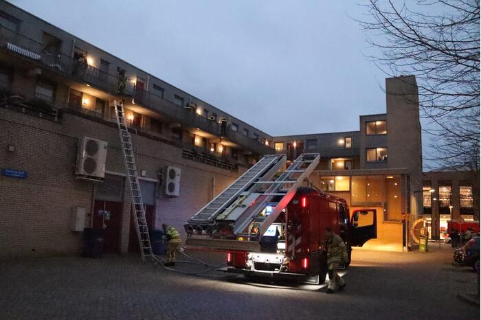 Brand in flatwoning boven winkels